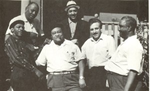 From left to right: Little Walter, Sunnyland Slim, Roosevelt Sykes, Jump Jackson, Paul Oliver, and Little Brother Montgomery, Chicago, 1960.
