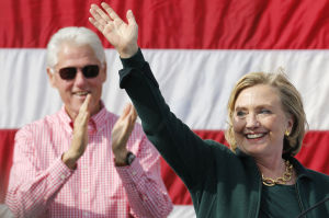 Former U.S. Secretary of State Hillary Clinton is applauded by her husband former U.S. President Bill Clinton at the 37th Harkin Steak Fry in Indianola, Iowa, Sept. 14, 2014. Photo by Jim Young/Reuters