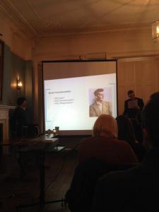 Dr. Martin Eve with a slide depicting Wittgenstein. Photo credit:  Dr. Clare Hayes-Brady (UCD). 